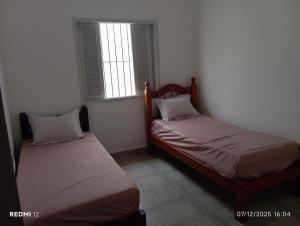 Casa Familiar Espaçosa,Churrasqueira e Garagem para 2 carros, 400m Praia