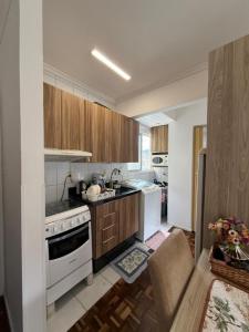 Apartamento com AR, proximo a roda gigante com lazer