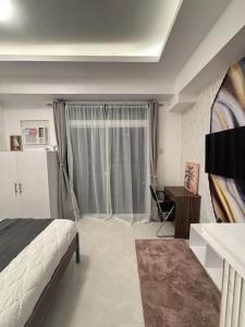 Elegant Studio with Balcony and City View