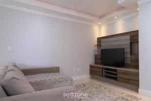 Apto prox a praia e com churrasqueira IBL103