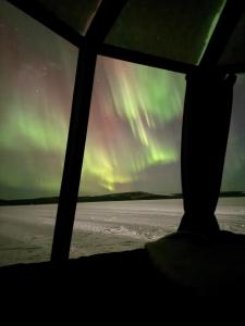 Unique Warm Glass Igloo on a frozen lake in Ivalo