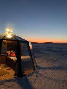 Unique Warm Glass Igloo on a frozen lake in Ivalo