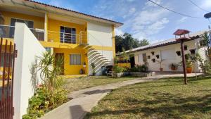 Casa prática e acolhedora na Praia do Santinho