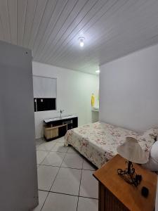 Casa prática e acolhedora na Praia do Santinho