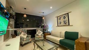 Apartamento Frente Mar Guarujá Pitangueiras 3 Suítes Ar Condicionado Garagem Fixa Serviço de Praia ao Lado do Morro do Maluf