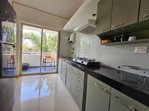 Serene 2BHK Porvorim Apartment with Forest View & Pool Access