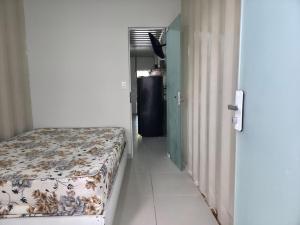 Apartamento Térreo em Itapema Bom Custo Ar condicionado e vaga de estacionamento QQ