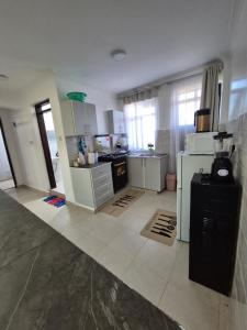 CM Snug stay -Naivegas Apartments