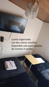 Cuarto con Cama King y Smart TV en apartamento compartido en Tunja