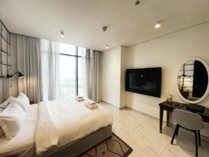 Petals Homes Millennium Atria 1 bedroom with Balcony