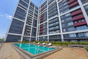 Elegant 2-Bedroom Apartment with Pool & Balcony