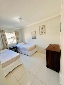 Incrível Apartamento vista mar a poucos passos da praia com 3 dormitórios