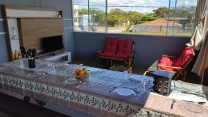 Sobrado Inteiro pé na areia em Itapoá!