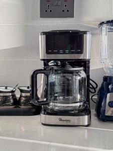 Sleek 1BR Retreat near JKIA, SGR Stn, Gateway Mall