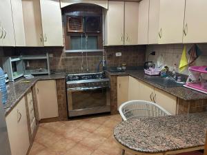 Comfortable apartment with a private garden near AUC شقه فندقيه