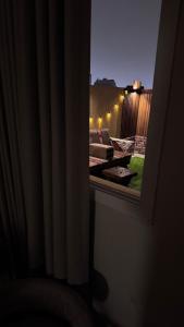 Elegant studio with 65-inch screen and outdoor seating