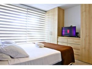 Oasis in Zona T with 2 Queen Beds, Pool, Sauna & Gym