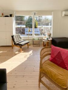 Summer Bliss With Vibrant Garden In Nødebohuse