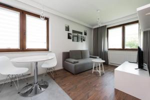 White and Grey Apartment in Cracow with Parking by Noclegi Renters