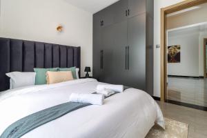 newly furnished two bedroom apartment with swimming pool, fully equipped gym, private parking space ,children playground and unbeatable scenic city views