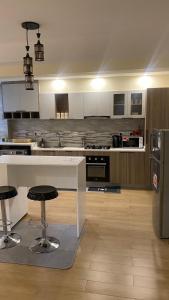 supreme living apartments with well equipped gym heated swimming pool ample parking area, children playing ground and amazing scenic views