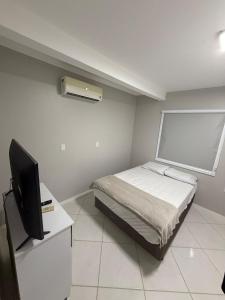 Casa aconchegante a poucos passos da praia!