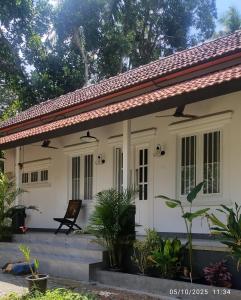 Peaceful 1 BHK country home with open veranda & nature views in Thrissur, Kerala