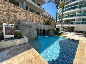 Flat com piscina na beira da praia do Recreio