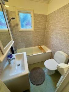 House near forest and water