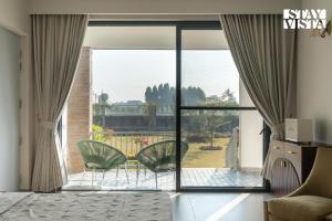 StayVista at Treeansh with Pool, Lawn