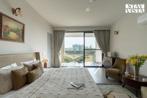 StayVista at Treeansh with Pool, Lawn