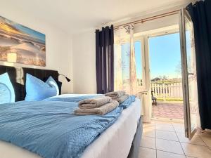Ferienwohnung Muschel 1 mit Terrasse und Garten, Bensersiel