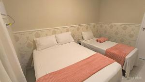 Apê no Guarujá, ar, wi-fi, garagem e praia a pé!