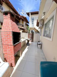 Casa de Praia Duplex - 3 suites toda climatizada em condominio com piscina e sauna