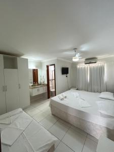 Casa de Praia Duplex - 3 suites toda climatizada em condominio com piscina e sauna