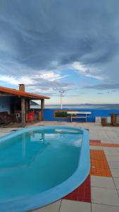 casa de praia com piscina frente a praia