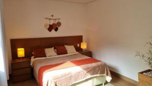 Casa Aconchegante em Escarpas do Lago 4 suítes e piscina com vista