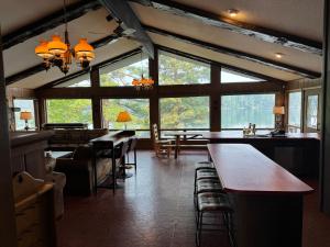 Exclusive Private 20 Acre Round Lake Waterfront Estate Hayward WI 6 Bedroom Ranch Style Lodge Private Boat Docks Fire-Pit Sunrise to Sunset Views Swim Beach Situated on 2000ft Sandy Lakeshore