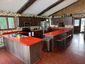 Exclusive Private 20 Acre Round Lake Waterfront Estate Hayward WI 6 Bedroom Ranch Style Lodge Private Boat Docks Fire-Pit Sunrise to Sunset Views Swim Beach Situated on 2000ft Sandy Lakeshore