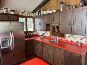 Exclusive Private 20 Acre Round Lake Waterfront Estate Hayward WI 6 Bedroom Ranch Style Lodge Private Boat Docks Fire-Pit Sunrise to Sunset Views Swim Beach Situated on 2000ft Sandy Lakeshore