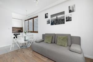 White and Grey Apartment in Cracow with Parking by Noclegi Renters