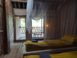 Muong Bi Homestay - a wooden stilt house owned by Uncle Lon in Luy Ai village