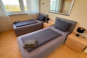 Zentrales Apartment für bis zu 5 Personen mit Balkon, Parkplatz, Waschmaschine & direkten Einkaufsmöglichkeiten