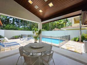 Casa p 14, piscina e churrasqueira 10min da praia