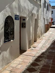 Casa Maroto - Boutique Stay in het hart van Comares, Rooftop terras, uitzicht op zee en bergen, gratis wifi