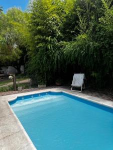 Habitación doble con balcón y pileta en las sierras Unquillo
