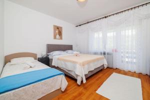 Beschauliches Apartment nur 650 Meter zum Strand mit Fitnessraum, Meerblick, Grill