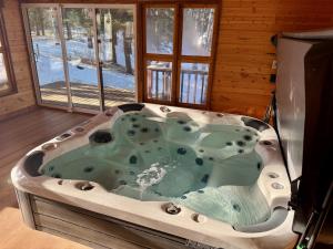 Bragg Creek Vacation Estate with hot tub, sauna, pool table, karaoke, private pond and forest trails