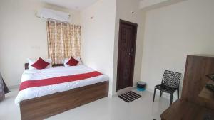 Hotel O KSR Guest Rooms