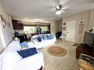 Sunny 2BR Condo with Pool Steps to Town & Beach
